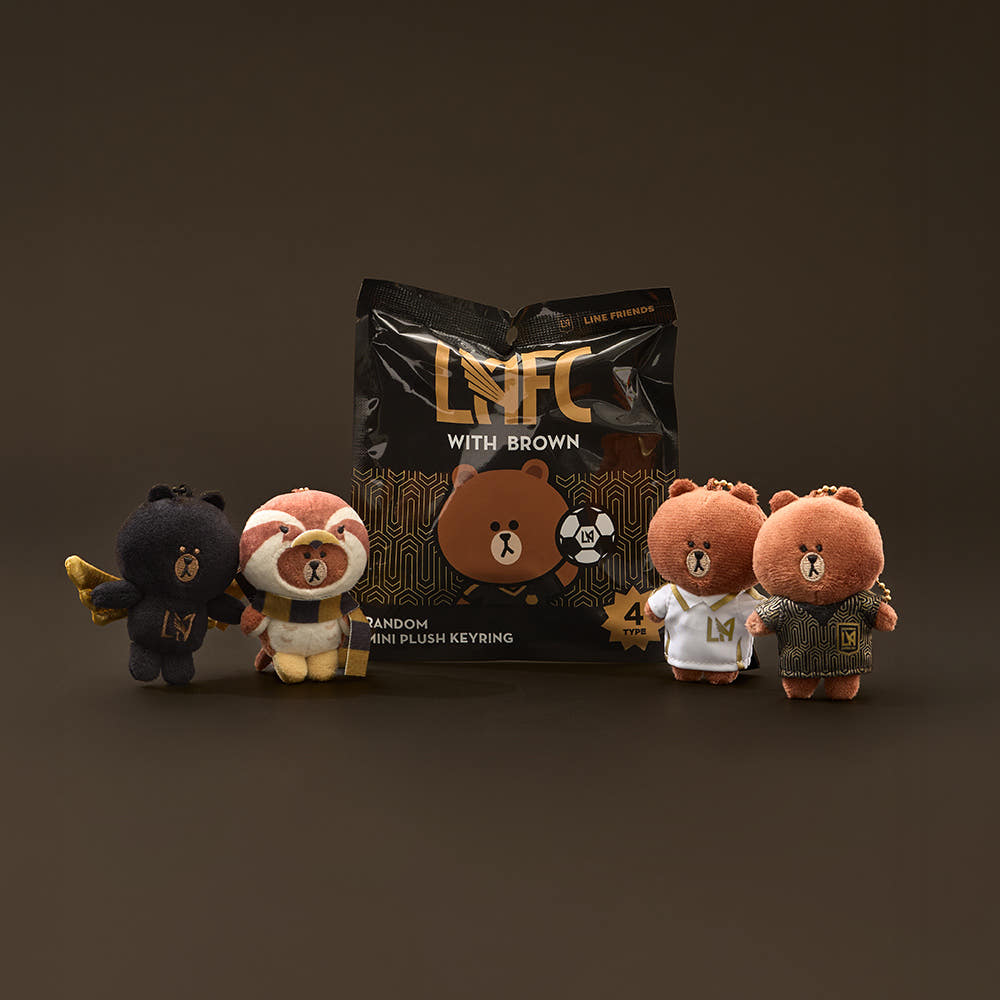 Add a playful touch to your collection with the Mini Doll Keyring (Random) from the Brown x LAFC collaboration.