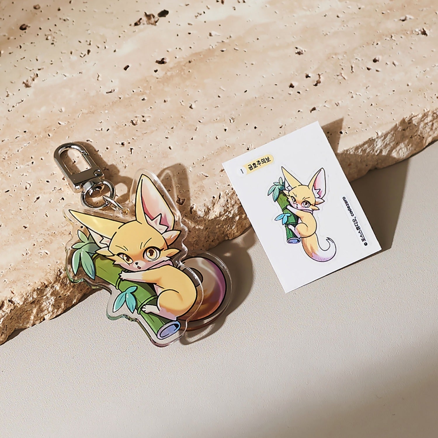 Carry a piece of Chronicles of the Demon Faction with you wherever you go with the Geumho Acrylic Keyring.