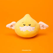 Add a soft and playful collectible to your Cookie Run collection with the Cookie Run - Crumble Golden God Bell Squishy Plush.