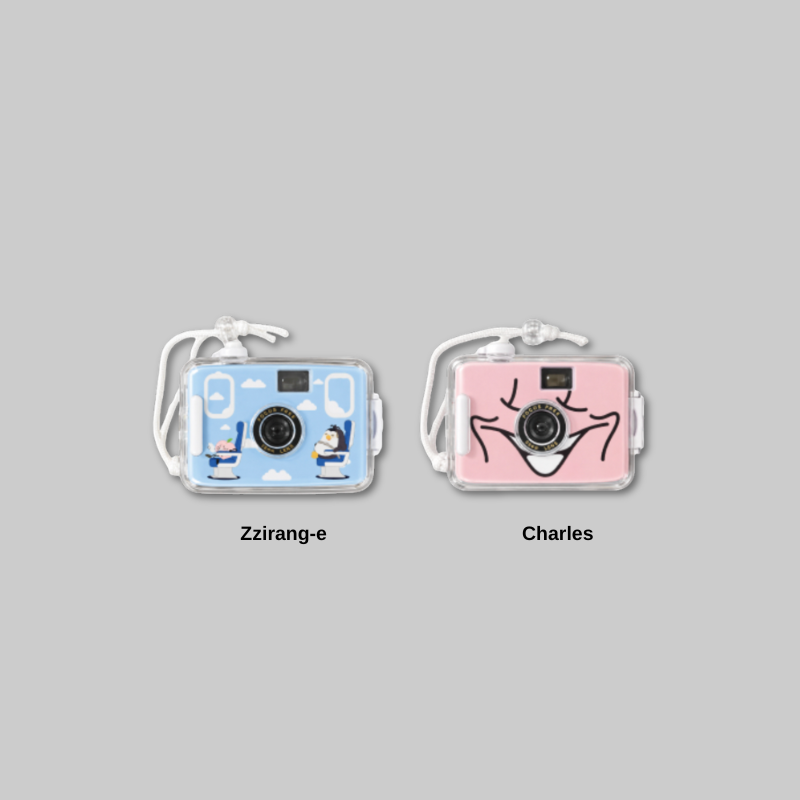 Add a playful touch to your collection with the DAY OFF AIRLINE: D.O ZZirang-e &amp; Charles - Toy Camera.