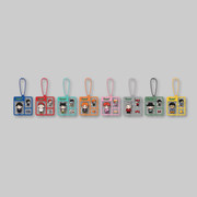 Enjoy the excitement of a surprise collectible with the official G-DRAGON x FAM POP-UP: G: A BOY'S JOURNEY – Acrylic Miniature Keyring (Random). 