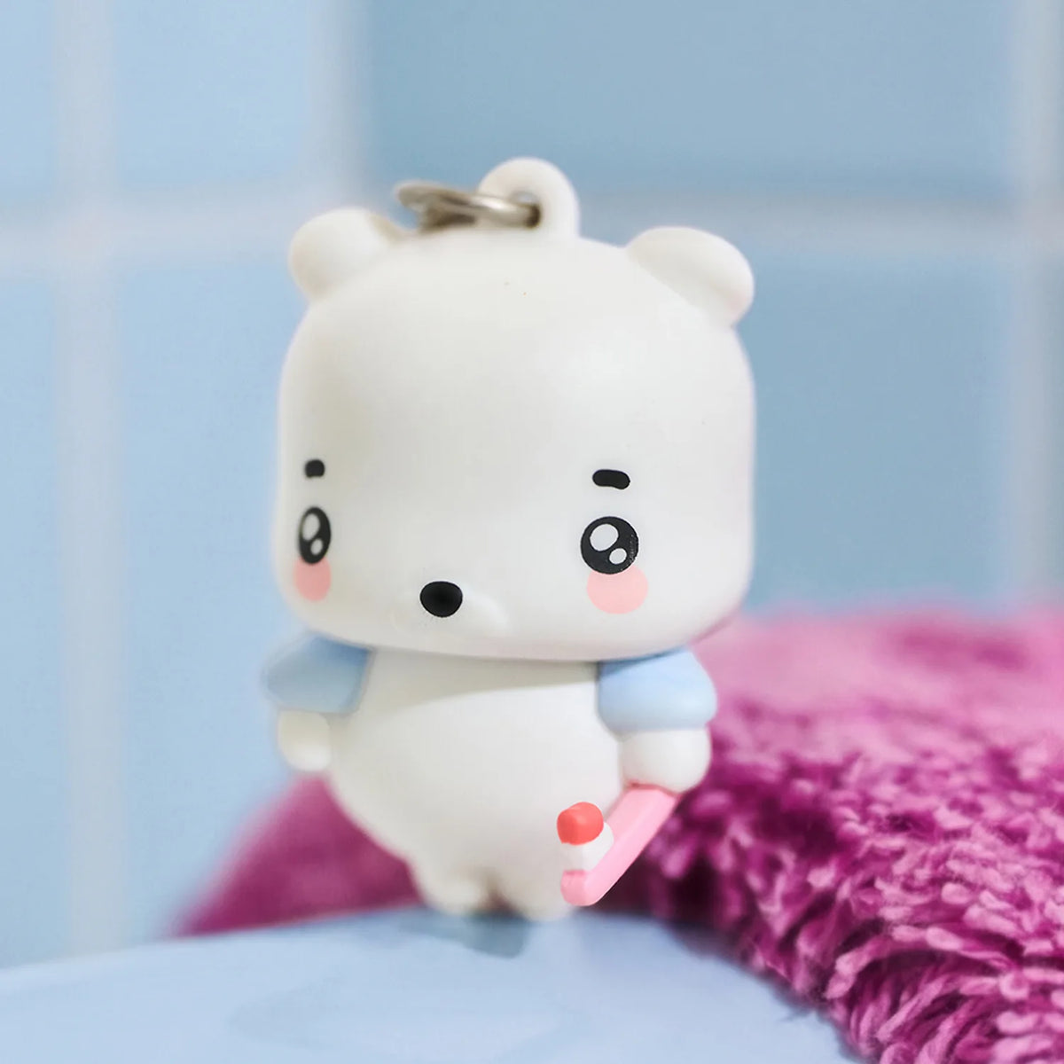 Add a playful touch to your everyday accessories with the Kakao Friends - Bokshimi Figure Keyring.