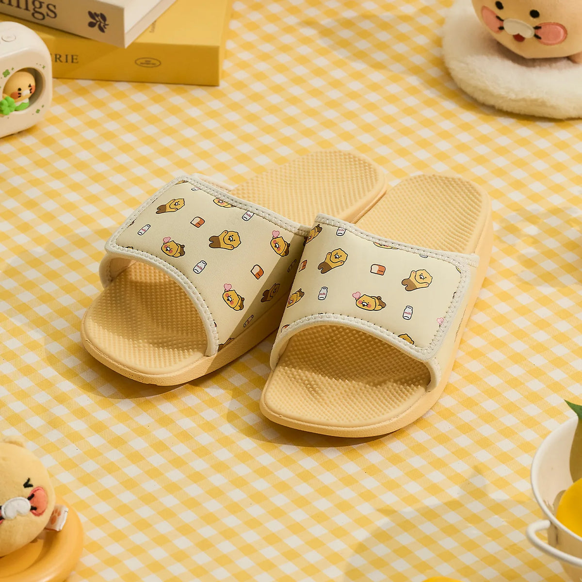 Add a playful touch to your everyday comfort with the Kakao Friends - Chunsik Caloring Kok-Kok Massage Slippers Yellow.