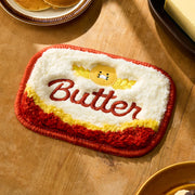 Add a playful touch to your space with the Kakao Friends - Chunsik Grocery Market Butter Mini Rug.