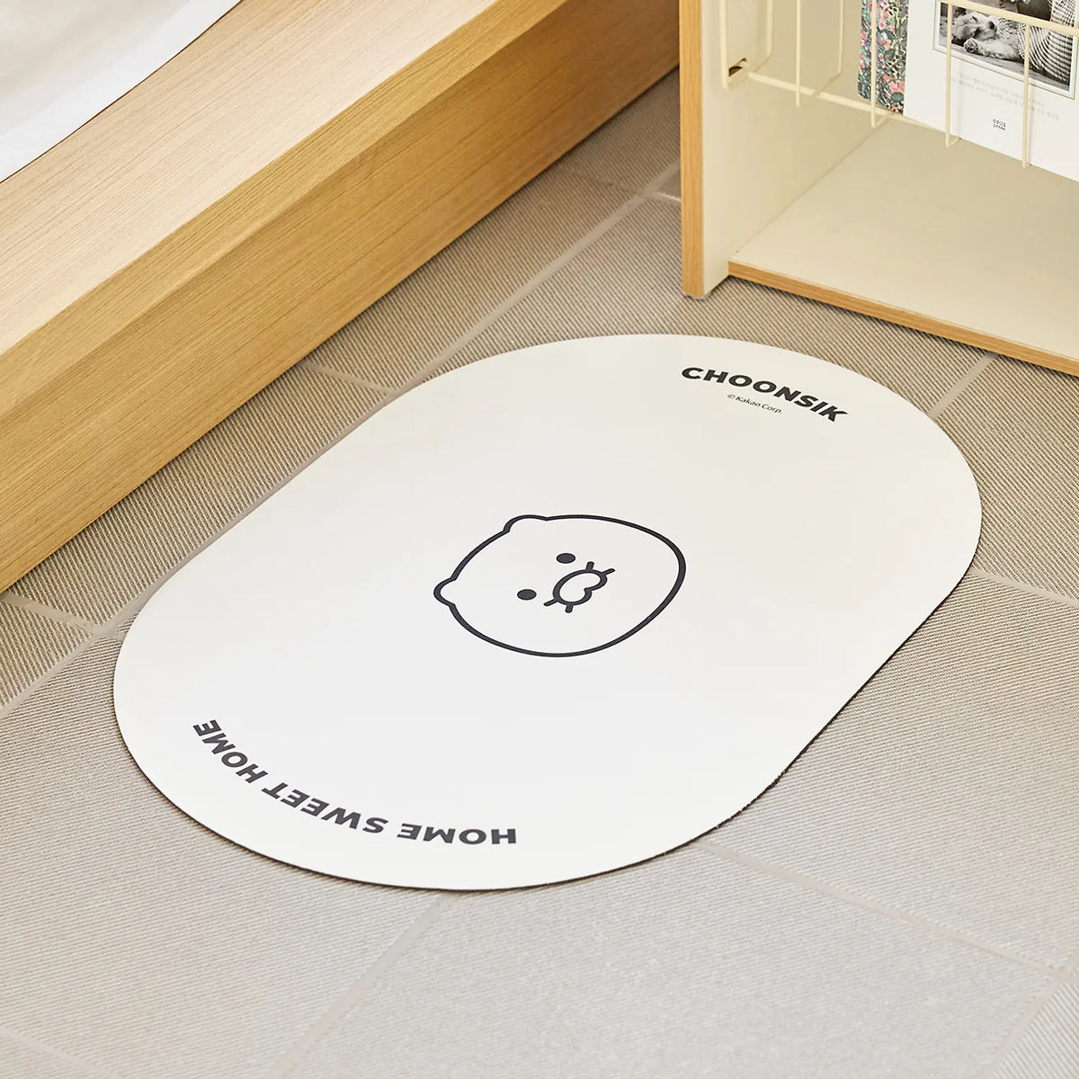 Add a playful character-inspired touch to your space with the Kakao Friends - Chunsik Round Short Earth Mat.