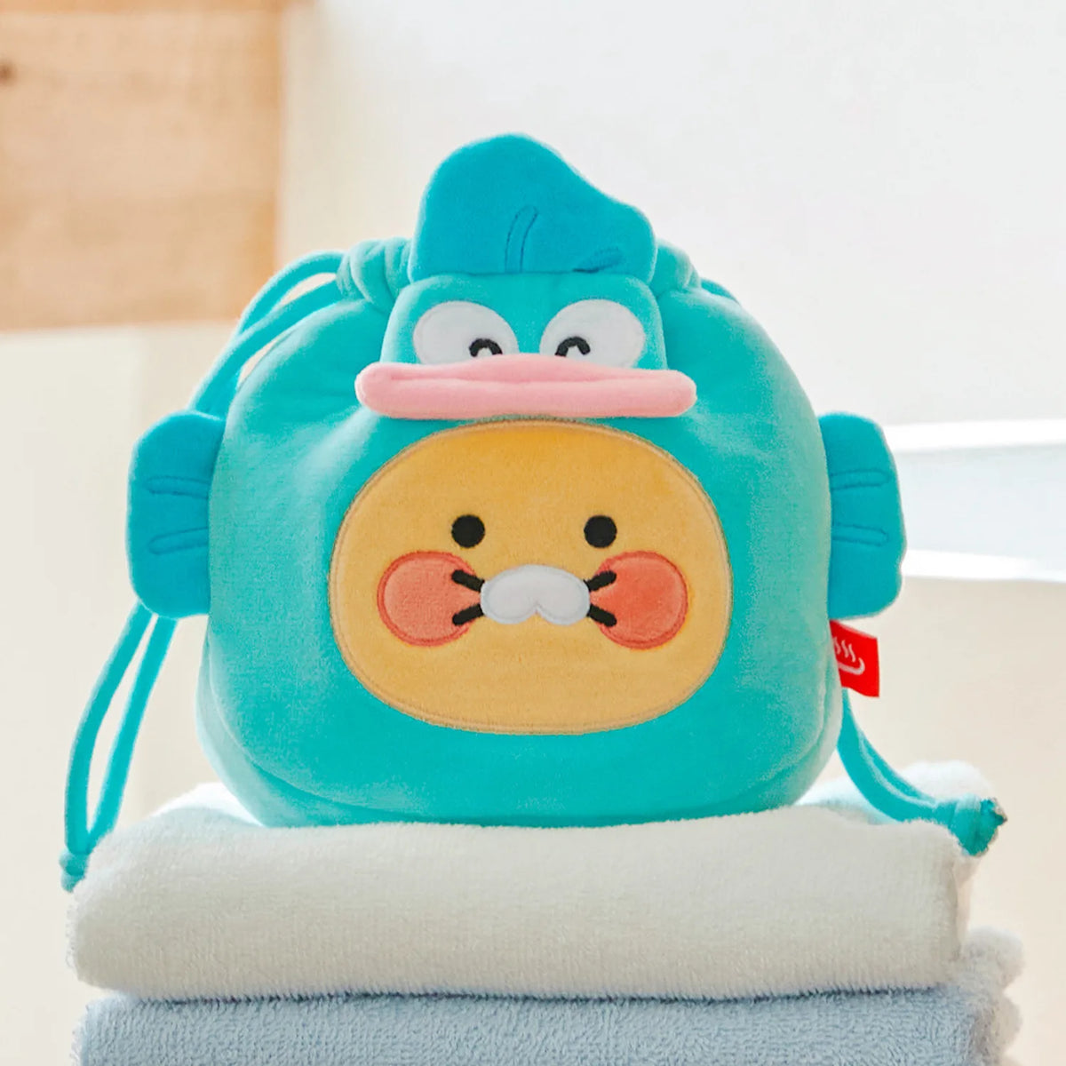 Carry your everyday essentials in adorable style with the Kakao Friends x Hangyodong - Chunsik Face Pouch.