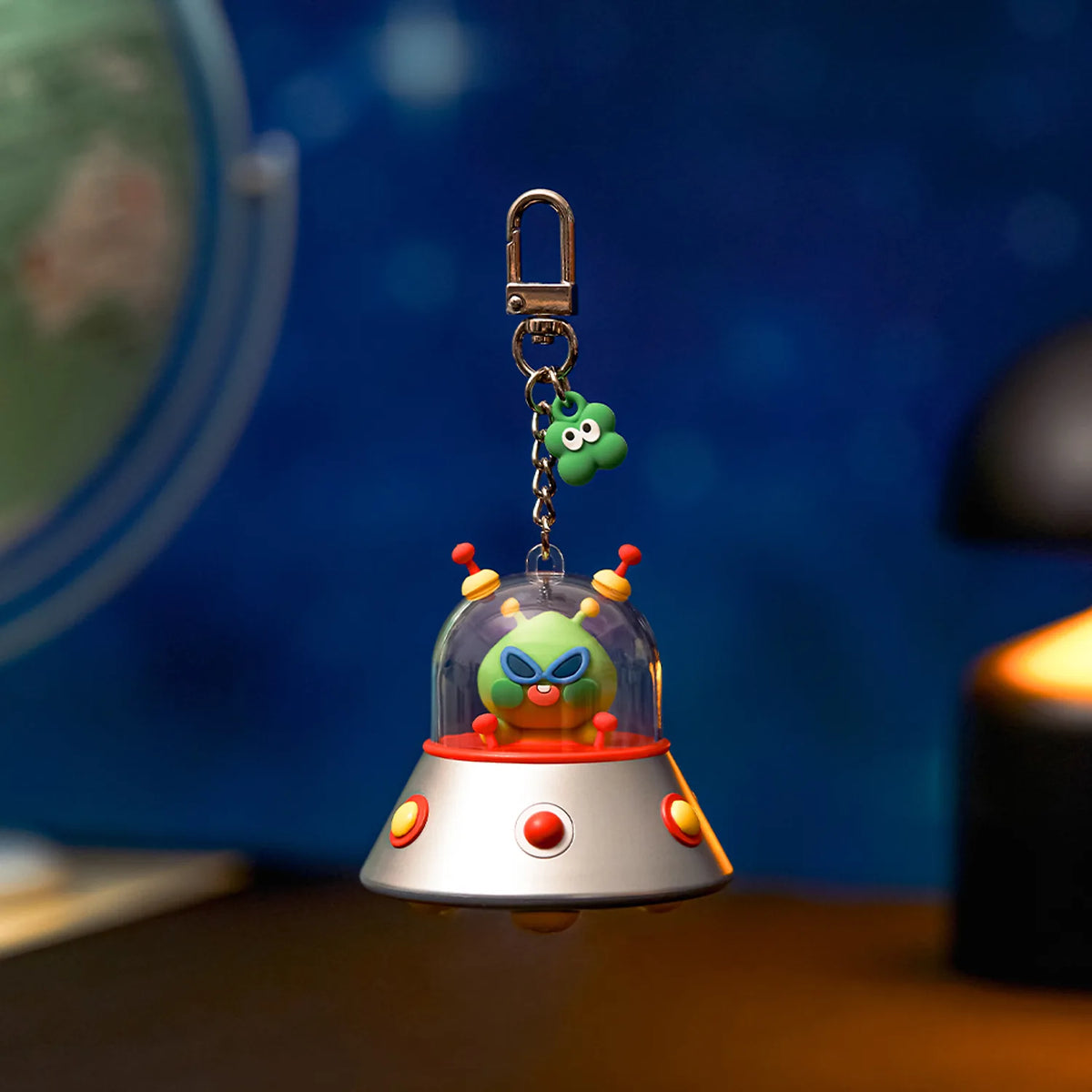 Add a playful collectible to your accessories with the Kakao Friends - Lucky Alien UFO Beam Keyring.