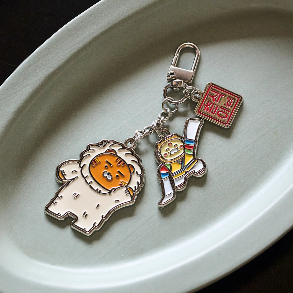 Add a cultural touch to your accessories with the Kakao Friends Yennal Yenchun Traditional Korean Mask Dance Keychain.