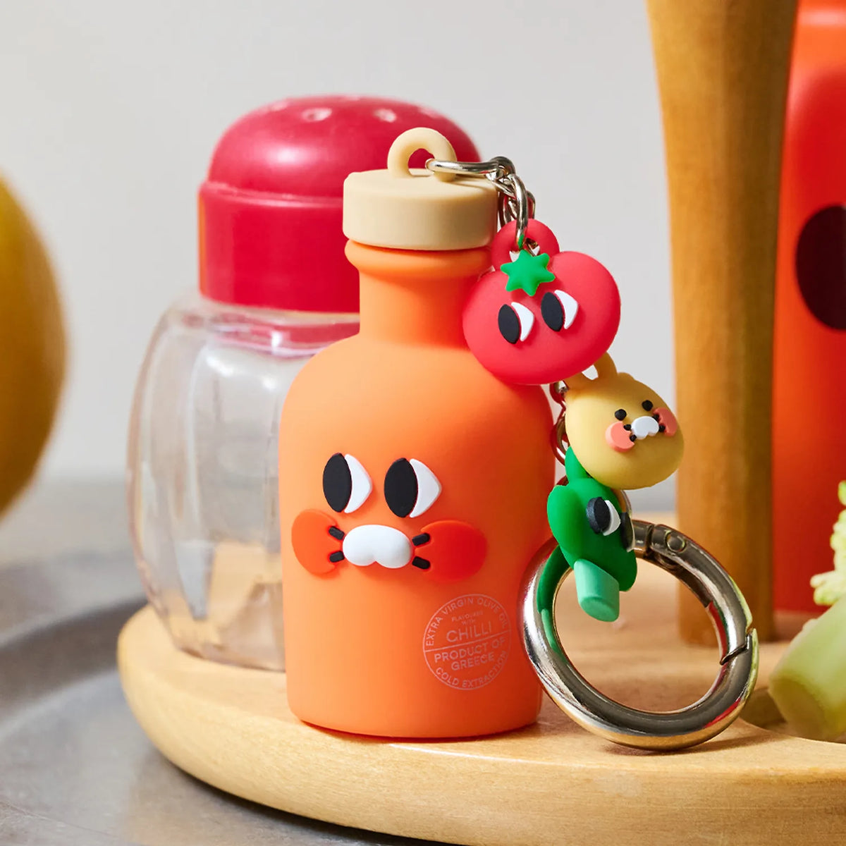 Add a fun and distinctive accessory to your collection with the Kakao Friends x Yiayia and Friends - &nbsp;Chunsik Olive Oil Figure Keyring.