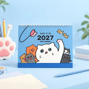Keep track of important dates throughout the year with the Meow Man - 2027 Desk Calendar.